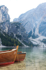 Pragser Wildsee, Lake Prags, Lake Braies, Lago di Braies, Prags Dolomites in South Tyrol, Italy; Boat rental in Pragser Wildsee; Beautiful Lake in Italy with Mountain in the Background; Italy Tourists