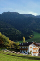 Wooden House at the Famous Santa Maddalena Village, Val di Funes valley, Trentino Alto Adige region, Italy; Beautiful View of the Dolomites Mountains in the Background