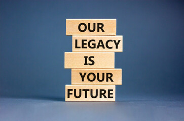 Legacy and future symbol. Concept words Our legacy is your future on wooden blocks. Beautiful grey...
