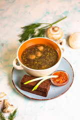 mushroom soup with toast in a cafe on the table
