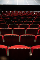 empty theater with red chairs