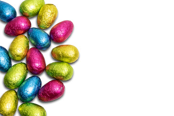Chocolate Easter eggs wrapped in colorful foil isolated on white background.