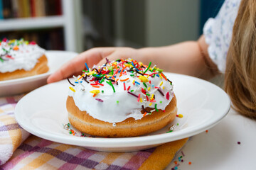 Process of decorating a cake with sweet colored decorations