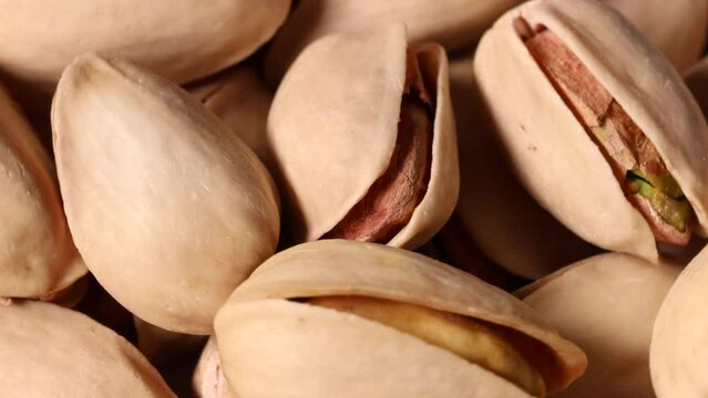 Pistachios turning slowly in close up