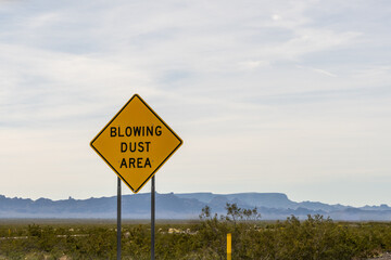 Blowing Dust Area sign on Interstate 10 heading west. Dust storms occur most often during monsoon season, June through September, but they can happen at any time of the year.