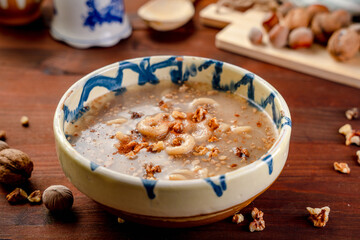 Romania traditional food desert Macinici or Mucenici on traditional plate and dark wood table