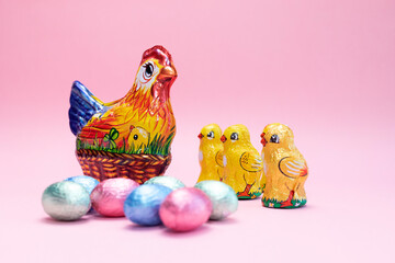 Easter, Paschal kids gift. Chocolate hen, little chickens with festive colorful bright sweet eggs...