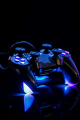 Black gamepads on black background in neon lights. Copy space. Generative AI. 7
