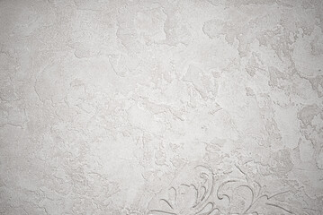 Gray background of decorative plaster with abstract spots. Unusual silver wall texture with...