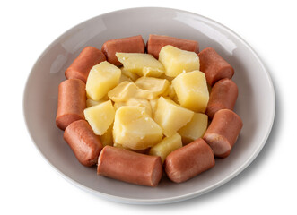 Sliced wurstel and boiled potatoes with mayonnaise in white dish ..