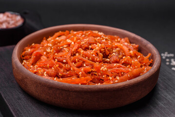 Dried squid chopped into slices and seasoned with sesame seeds and spices