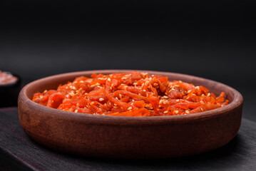 Dried squid chopped into slices and seasoned with sesame seeds and spices