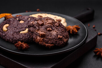 Delicious fresh crispy oatmeal cookies with chocolate and nuts