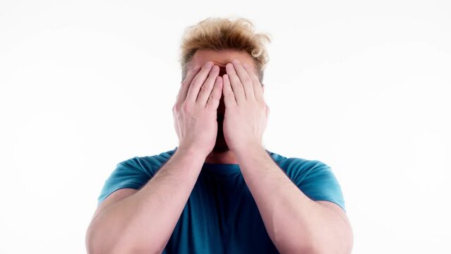 Man opening and covering face with hands, playing hide changing facial expressions. Guy showing various grimaces, happiness sadness amazement, peekaboo gesture isolated on white.