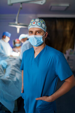 Portrait of doctor standing in operating room. Surgical healthcare specialist.