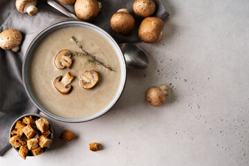 Mushroom soup close up with ingredient on white table