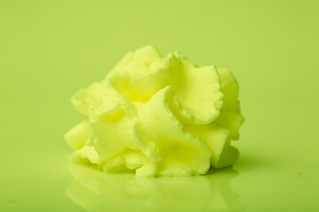 Cake cream texture, sweet whipped cream. Background of yogurt close-up with a pattern. Pistachio mousse.