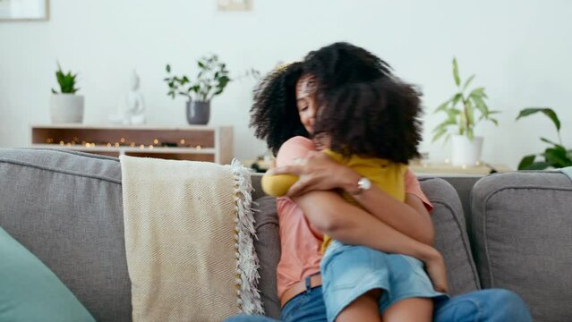 Mother, child and running for hug on sofa in home with love, care and support of black family. Woman and girl together for bonding, play and fun in house living room while happy with energy and smile
