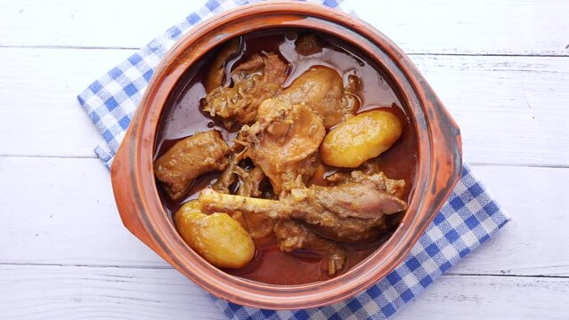 Chicken curry or masala in a bowl on table 