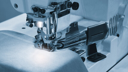 Professional sewing machine and sews garments,  textile fabric production industrial concept background