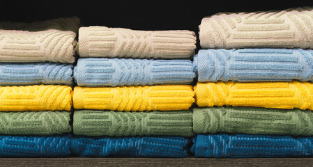 Colorful folded towels stack closeup picture, hotel service concept background