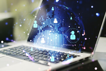 Social network media concept with world map and modern computer on background. Double exposure