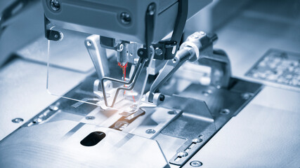 Professional sewing machine and sews garments,  textile fabric production industrial concept background