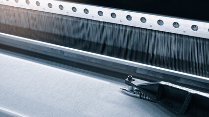 straight strands texture background, sewing equipment, loom equipment at a garment factory