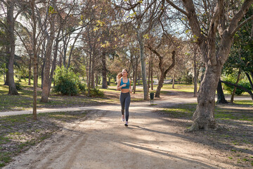 Young caucasian woman embraces the outdoors with her running routine.