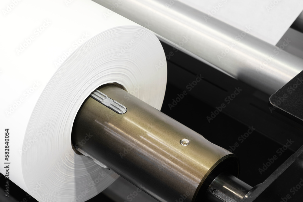 Poster rolls paper and fabric in wide industrial plotter