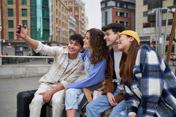 Fototapeta premium Friends taking selfie on a bench in Spain.