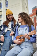 Joyful friends enjoy ukulele tunes