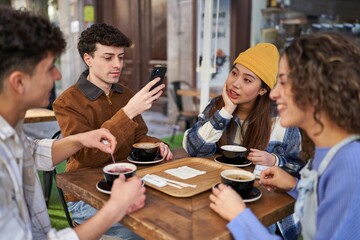 Friends from diverse cultures share laughs over coffee and tea.