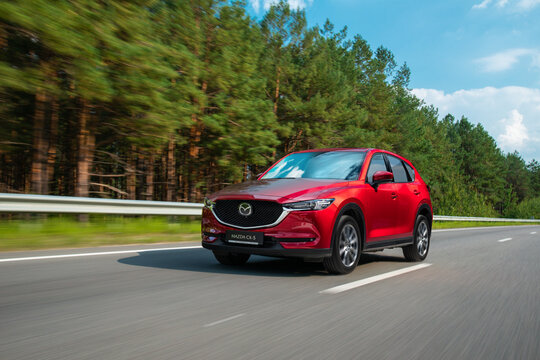 Kyiv, Ukraine -September 1, 2021: Car on the road, red Mazda CX-5 in motion on highway