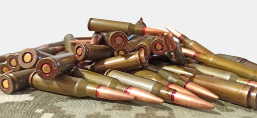 Heap of bullets against white background. Military concept. War for freedom
