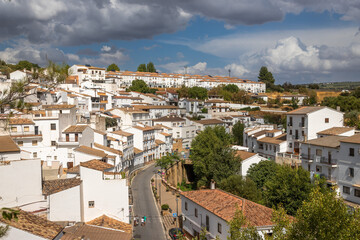 Exposure of Setenil de las Bodegas famous for its dwellings built into rock overhangs above the Río Guadalporcún, Cadiz, Spain
