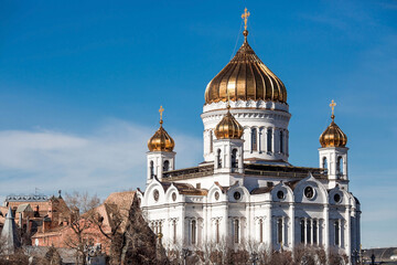 Fototapeta premium Russian Orthodox Cathedral - The Cathedral of Christ the Savior in Moscow against the blue sky on a sunny spring day. Russian Federation, Moscow.