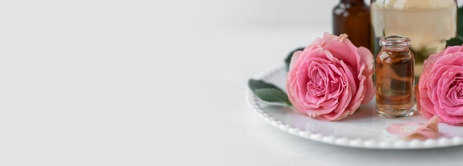 Aromatherapy. Pure organic essential rose oil concept. Elixir with plant based floral herbal...