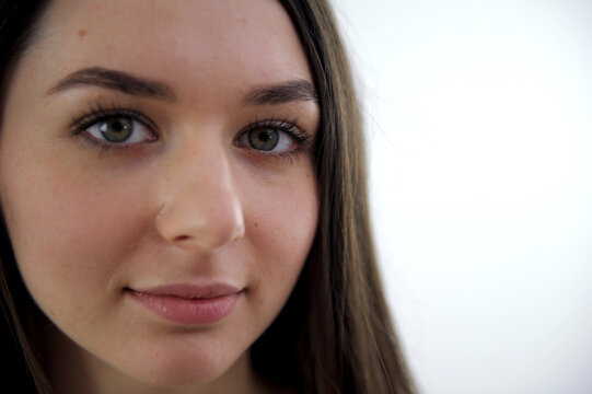 beautiful face of a young girl big high forehead long hair lips bow close-up european ukrainian nation