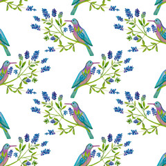 Seamless pattern with blue birds and flowers painted in watercolor on a white background.