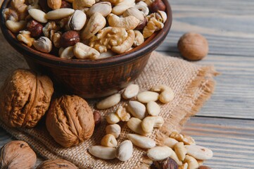 Various nuts on a plate, top view.