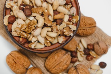 Various nuts on a plate, top view.