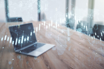 Multi exposure of abstract creative financial chart with world map on laptop background, research and analytics concept