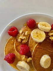 pancakes with strawberries bananas and nuts