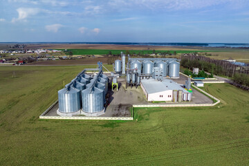 aerial view of agro-industrial complex with silos and grain drying line