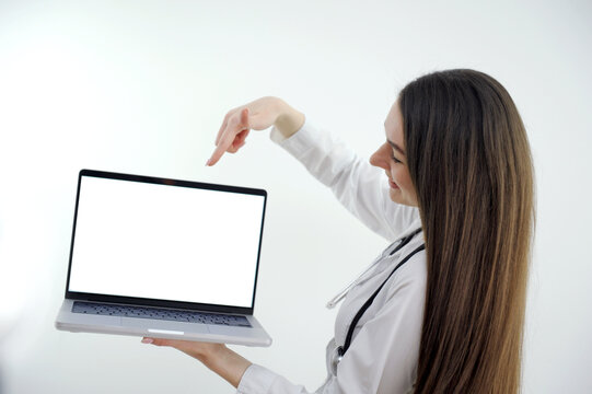 Female doctor making video call on laptop mock up screen with patient . High quality photo
