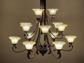 Side view of a tea light style chandelier inside a large home