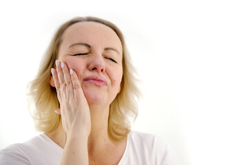 toothache cute middle-aged woman holding cheek squinting eyes squeezing her lips hard tooth hurts going to dentist need urgent help ambulance in dental clinic white background for advertising text