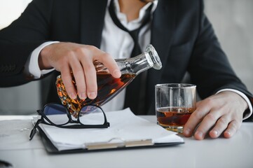 Young businessman drinking from stress