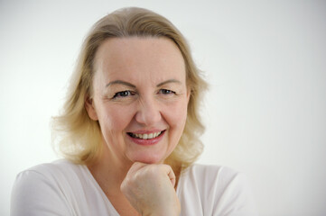 woman conceived a scam screwed up her eyes slyly smiles slyly looks from under her forehead leaned...